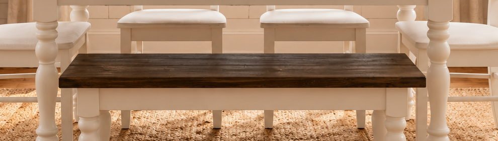 Close view of dark walnut tabletop and antique white dining set details